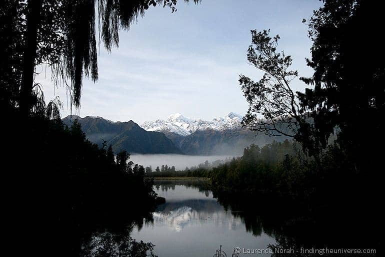 Mirror lake reflection Lake Matheson southern alps New Zealand Mirror lake reflection Lake Matheson southern alps New Zealand